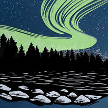 Load image into Gallery viewer,  Northern lights artwork. A rich neon green aurora ink on top of a dark blue backround behind the shadows of a Black Forest. A lake in the foreground showing some light on rocks. A close up photo of the aurora borealis artwork
